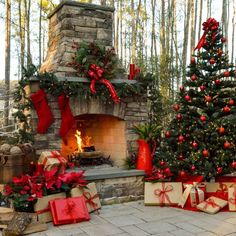 christmas trees and presents in front of a fireplace