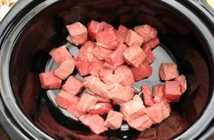 cubes of meat are in the slow cooker