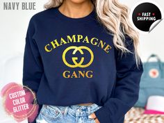 "Champagne Gang Sweatshirt, Women's Custom Glitter Sweatshirts, Bachelorette Party Shirt Gold Glitter, Oversized Sweatshirt, Champagne Gifts for Her ❤ 🌟 Please choose your color design in the personalized box 🌟  Example: Gold Glitter  We have many colors to choose from, please message me with any questions you may have.  *For an oversized look, please size up, sizing chart located in photos above*  Matching Canvas Tote bags now available in natural or black. ~ Width approximately 14 ~ Height approximately 15 ~ 22 \" handles 100% Cotton  🌸Care instructions🌸 All shirts should be turned inside out and washed on a cold wash.  Please hang dry. *If you have any concerns, or needing any more information before placing your order, please feel free to send us a direct message, and we will get b Winter Party Sweatshirt With Crew Neck, Winter Party Crew Neck Sweatshirt, Casual Winter Party Sweatshirt, Casual Winter Party T-shirt, Trendy Long Sleeve Party T-shirt, Trendy Long Sleeve Glitter Top, Trendy Long Sleeve T-shirt For Party, Casual Party Sweatshirt, Fall Party Tops With Letter Print