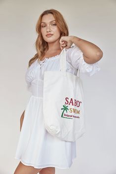 The perfect beach or market bag! The Seaside Tote Bag is made from white canvas and features embroidered Sabo Swim detailing. Sabo Skirt, The Seaside, Market Bag, White Canvas, Swimming, Tote Bag, Canvas, White