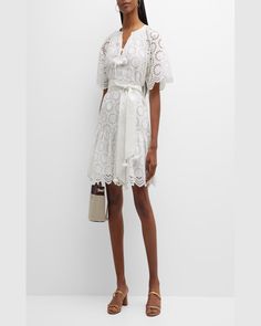 Figue "Bria" dress featuring eyelet embroidery, scalloped edges, and tassels    Split V neckline; selftie front    Short sleeves    Selftie belted waist    Aline silhouette    Midthigh length    Ruffle flounce hem    Slipover style    Cotton    Imported Eyelet Embroidery, Color Magic, Scalloped Edges, Top Designers, Unique Print, Neiman Marcus, Bead Work, Tassels, The Dress