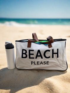 Beach bag with Beach Please printed on the front in black Large Capacity Beach Tote Canvas Bag, Large Capacity Sand-colored Beach Bag, Large Capacity Canvas Tote Bag For Beach, Large Capacity White Canvas Bag For Beach Season, Large Capacity Tote Canvas Bag For Beach, Canvas Beach Tote Bag For Vacation, Summer Canvas Bag For Beach Travel, Canvas Tote Beach Bag For Vacation, Summer Canvas Beach Bag For Travel