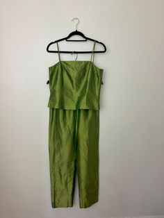 This Y2K era tank top and pants set dazzles with its amazing iridescent green fabric that shimmers with every movement. The tank top features a sleek, fitted design, while the matching pants offer a flattering, high wasted, tapered cut. Both pieces boast a striking brat-coded color, making this set a standout choice for those who don't shy away from color. Best to fit a size small/medium. See measurements. Satin Two Piece Set, Wedding Rehearsal Dress, Womens Suits, Y2k Era, Color Making, Silk Set, Iridescent Green, Rehearsal Dress, Tacoma Wa