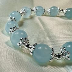 Aquamarine Bracelet, March Birthstone Crystal Bracelet Gemstone Bracelet Stretch Bracelet Free standard domestic shipping (Australia) for orders over $49.95 AUD. Free standard shipping when you buy two or more items (Domestic and international buyers). This bracelet is made with 8.5mm aquamarine. Bracelet is double corded with high quality elastic cord for durability. Default size of this bracelet is 18cm (7 inch). Bracelet can be made smaller if required (but not larger due to limited material) Crystal Stone Bracelet Ideas, Adjustable Aquamarine Silver Bracelet, Adjustable Silver Aquamarine Bracelets, Adjustable Silver Aquamarine Bracelet, Aquamarine Bracelet Jewelry As A Gift, Aquamarine Bracelet Jewelry Gift, Elegant Aquamarine Silver Bracelets, Aquamarine Gemstone Beaded Bracelets, Aquamarine Gemstone Beads Bracelets As Gift