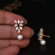 A bunch of beautiful natural white hand picked marquise and tear drop diamonds, arranged neatly to form a triangle, with a beautiful light pink pearl dangling from the center render the design in a way that your heart will surely skip a beat.. Ours did.. :) * Diamond Wt. : 1.05 Cts (Marquise + Pear) approx * Color-Clarity Grade : Near Colorless, Vs-Si Purity * Gold - 14k, 3.28 gms rose gold An exclusive piece from our shop, these earrings are absolutely to die for..! Special Earrings for your sp Fine Jewelry Pear-shaped Cluster Earrings For Wedding, Pear-shaped Diamond White Cluster Earrings For Wedding, Wedding Teardrop Diamond Earrings, Teardrop Diamond Cluster Earrings For Wedding, White Rose Cut Diamond Earrings For Wedding, White Rose Cut Diamond Wedding Earrings, Wedding White Rose Cut Diamond Earrings, Marquise Cut Cluster Earrings For Wedding, White Diamond Cluster Earrings, Pear-shaped