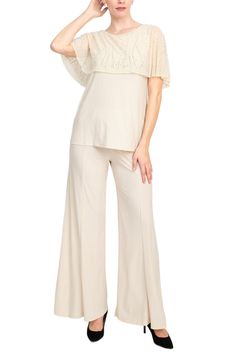 Sophisticated Ensemble Elevate your style with our Marina Boat Neck Embellished Capelet Sleeve Top and Elastic Mid Waist Wide Leg Pant Set, designed to exude elegance and sophistication. Perfect for social occasions, formal events, and special celebrations like weddings, this ensemble combines comfort with timeless charm. Crafted from high-quality jersey fabric, the boat neck top features embellished capelet sleeves that add a touch of glamour to your look. The elastic mid waist ensures a comfor Embellished Stretch Pants For Evening, Embellished Bottoms For Formal Spring Events, Chic Embellished Fitted Pants, Elegant Embellished Pants For Spring, Chic Embellished Pants For Summer, Elegant Stretch Pants For Spring, Elegant Embellished Evening Pants, Elegant Embellished Pants For Evening, Chic Embellished Evening Pants