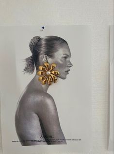 a woman's profile is featured in an ad for sepia magazine, featuring gold earrings