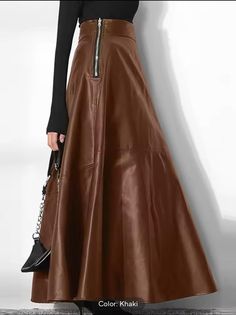 Elevate your wardrobe with this elegant maxi skirt. Crafted from high-quality faux leather, this skirt is perfect for the fall, spring, and autumn seasons. With a vintage style and a flattering fit, it's the perfect addition to any fashion-forward woman's collection. Ideal for any occasion, this skirt is made from durable and stylish material that will last for years to come. The faux leather provides a luxurious look and feel, while the maxi style adds a touch of sophistication. Perfect for wom Pu Leather Skirt, Solid Skirt, Office Skirt, Fashion Bottoms, Womens Maxi Skirts, Long Skirts For Women, Elegant Skirt, High Waist Fashion, Casual Skirts