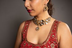 Our Shreya Jewelry Set is simple and elegant. This beauty is designed with premium quality kundan and hand-painted back meenakari. Hand-crafted to perfection, this two-layered kundan necklace set includes a neckace a pair of earrings, and a Maang Tikka. This lovely jewelry set will elevate any Western or Indian outfit on all occasions. Specifications Materials used: premium-quality kundan, high gold plating At Romikas, we pride ourselves on the craftsmanship and high quality of our jewelry, desi Festive Chandbali Jewelry Set With Mirror Work, Diwali Chandbali Jewelry Sets With Mirror Work, Bollywood Kundan Necklace, Bollywood Style Kundan Chandbali Necklace With Mirror Work, Temple Style Chandbali Kundan Necklace With Mirror Work, Kundan Necklace With Gota Work For Diwali, Kundan Meenakari Temple Necklace For Party, Party Kundan Necklace With Zari Work, Festive Chandbali Kundan Necklace With Mirror Work