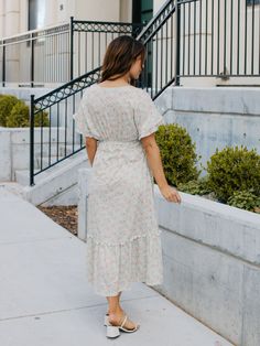 Looking for a dress that will make you stand out in a crowd? Look no further than the Floral Pattern Whitney Dress in mint floral! This dress is all about fun and flirty style, with a colorful floral print that's sure to turn heads. But it's not just about looks - this dress is designed to flatter your curves, with a tie waist that accentuates your figure. And with flutter sleeves and a midi length, it's the perfect combination of playful and sophisticated. Whether you're headed to a wedding, a Modest Ditsy Floral Midi Dress For Garden Party, Knee-length Floral Print Sundress For Brunch, Modest Flowy Floral Dress For Garden Party, Floral Print Knee-length Sundress For Brunch, Modest Ditsy Floral Dress For Daywear, Modest Ditsy Floral Print Dress For Daywear, Modest Flowy Floral Print Midi Dress, Floral Print Midi Sundress For Daywear, Modest V-neck Spring Dresses