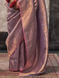 Our stunning purple silk saree, is exquisitely adorned with intricate zari weaving work. This exceptional piece is designed to highlight the elegance and sophistication of traditional Indian attire, making it the perfect choice for any special occasion. The rich purple hue, combined with the intricate zari patterns, offers a blend of luxury and grace that is sure to turn heads and make a lasting impression.
Spanning 5.50 meters, this saree provides ample fabric to create a beautiful drape, ensur Formal Purple Dupatta For Diwali, Festive Purple Traditional Wear For Formal Occasions, Purple Art Silk Pre-draped Saree With Self Design, Traditional Purple Dupatta For Formal Occasions, Purple Pre-draped Saree With Zari Work In Raw Silk, Purple Katan Silk Pre-draped Saree With Zari Work, Purple Pre-draped Saree With Zari Work, Formal Pink Saree With Zari Work, Traditional Purple Saree For Formal Occasions