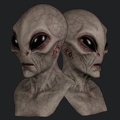 two alien heads are shown in this image