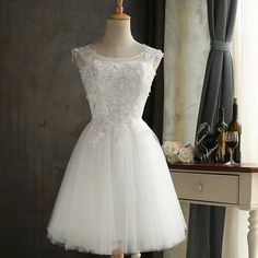 Lace bridesmaid dresses, short, slim white dress, sister dresses, sleeveless homecoming dressesMaterial:tulleColor:as picture or custom colorNeckline:o-neckBack details:bandageStyle:simpleDress type:A-line&ltp&gtFeatures:lace</p>&ltbr/>&ltp&gtCustomized service and Rush order are available.</p>&ltbr/>&ltp&gtThis dress could be custom made, there are no extra cost to do custom size and color.</p>&ltbr/>&ltp&gtPlease leave your phone number for shipping when you order the dress.</p>&ltbr/>&ltp&gt1 White Knee-length Bridesmaid Dress, White Sleeveless Mini Dress For Prom Season, White Prom Dress For Prom Season, Wedding Mini Dress With Lace Bodice, Knee-length Tulle Mini Dress For Wedding, White Knee-length Homecoming Dress, White Sleeveless Mini Dress For Prom, White Sleeveless Homecoming Dress, White Sleeveless Dress For Homecoming