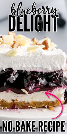 a close up of a cake on a plate with the words blueberry delight written below it