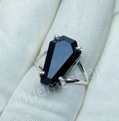 Coffin Ring, Black Onyx Ring, Black Onyx Coffin Ring, Onyx Ring, Handmade Ring, 925 Sterling Silver Ring, Black Onyx Coffin, JR109 Metal: 925 Sterling Silver Gemstones: Black Onyx Gemstone Shape: Coffin Gemstone Size: 10x17 mm Gemstone Category : Faceted Metal Purity: 925 Parts Per 1000 Ring Size : All Size Available Why do we wear silver rings? As a metal, silver has significant health benefits that have been used across cultures for centuries. Silver has a proven track record as a powerful ant Gothic Black Crystal Promise Ring, Gothic Black Formal Ring, Black Sterling Silver Crystal Ring, Black Onyx Gothic Rings, Gothic Black Onyx Rings, Gothic Onyx Ring With Gemstone, Black Gothic Ring With Polished Finish, Gothic Black Ring With Polished Finish, Gothic Onyx Gemstone Ring