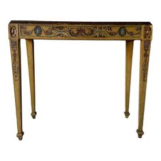 an ornately decorated console table against a white background