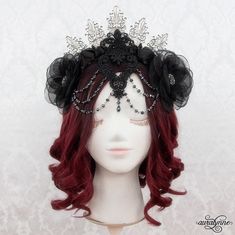 You'll be the queen of the night in this beautiful gothic Vampire crown.  It's a stunningly detailed piece - with layered venice lace appliques in front, draping crystal-cut glass beads. and flowers of varying textures - soft crystal organza and shining satin. - .v. - About my Crowns - .,_.^._,. - When I first started my business way back in 2006, I made headdresses for belly dancers.  They were designed to be easy to place (for quick costume changes) and they had to stay put too - thru twirls, shimmies, and more. Today, I use the same techniques to make my crowns.  The end result is a piece that goes on incredibly easily, and stays put perfectly thru all your costumed adventures. .v. --- Costume --- .,_.^._,. Do you like the full costume in the final photo?  Purchase it here: https://www. Vampire Crown, Evil Queen Crown, Quick Costumes, Gothic Crown, Vampire Clothes, Full Gown, Custom Crown, Vampire Queen, Queen Black