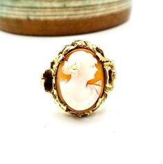 ANTIQUE CAMEO RING, 10K Yellow Gold, Floral Poppy Flower Setting, Circa 1950, Size 7, By E. S. Feinstein & Co.. Magnificent setting on this vintage Cameo ring. Art nouveau style of poppy flowers and leaves. It really makes the ring. Hallmarked 10K, Engraved inside of band, G.H.W. TO M.R.W., 1950. Measures a US size 7. Top setting measures about 3/4' x 3/4". Weighs 5.1 grams. Has an F makers mark within a triangle cartouche for the maker E.S. Feinstein & Co. based in New York, NY. Excelle Vintage 14k Gold Cameo Rings, Vintage Yellow Gold Cameo Rings, Vintage Rose Gold 14k Stamped Jewelry, Gold Cameo Rings For Anniversary, Vintage Gold Cameo Ring, Gold Cameo Ring Jewelry, Vintage Cameo Rings For Formal Occasions, Vintage Cameo Rings For Formal Events, Vintage Yellow Gold Oval Jewelry