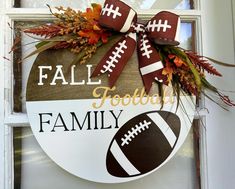 a wooden sign that says fall football and has a football on it with the words,'football family '