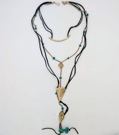 A hippe aethetic tri strand necklace with a beautiful pendant that hugs the neck, another one with a coin and a leaf and the longest one with a triangle. The strands are leather and chain. #tlb #bohogift #Handmade #HippieNecklaceSet #HippieJewelry Bohemian Long Layered Necklace With Clavicle Chain, Bohemian Layered Long Necklace With Clavicle Chain, Bohemian Layered Clavicle Chain Necklace, Bohemian Multi-strand Clavicle Chain Necklace, Bohemian Multi-strand Clavicle Necklace, Trendy Adjustable Lariat Layered Necklace, Bohemian Adjustable Clavicle Chain Necklace, Bohemian Metal Lariat Necklace With Adjustable Length, Adjustable Multi-strand Clavicle Chain Layered Necklace