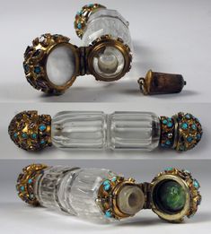 three pieces of glass with gold trimmings and blue stones on them, all in different shapes and sizes