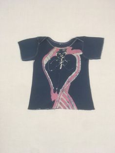 vintage 1970s baby t-shirt cotton hand dyed batik of a man on front and semi abstract sunrise/sunset over horizon on back light wear inc. back tear at hem-see photos no tag, cotton feel, baby size, see below measures, shoulder-8 1/4" chest-10" sleeve-3 1/2" length-13" Vintage Hand Printed Crew Neck Tops, Vintage Hand Printed Cotton Top, Vintage Hand Printed Short Sleeve T-shirt, Vintage Hand-printed Short Sleeve T-shirt, Vintage Hand Printed Tops For Summer, Grunge Pre-washed Short Sleeve Tops, Vintage Tie Dye Top With Screen Print, Vintage Tie-dye Top With Screen Print, Fitted Acid Wash Short Sleeve T-shirt