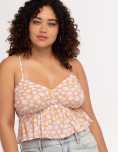 Rsq Daisy X-Back Babydoll Top. All Over Print. Adjustable X Back Ties. Ruffle Hem. Elastic Waist. 100% Rayon. Hand Wash. Imported. Model Is Wearing A Size Small. Model Measurements:height: 5'8" Bust: 30"waist: 23"hips: 35" Model Is Wearing A Size Xl. Model Measurements:height: 5'8" Bust: 42"waist: 32"hips: 44" Playful Orange Beach Top, Cute Floral Print Camisole Top, Cute Floral Print Cami Top, Playful Sleeveless Floral Print Top, Playful Floral Print Sleeveless Top, Flannel Sweatshirt, Girls Graphic Tee, Green Tank Top, Square Neck Top