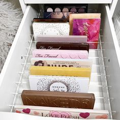 a drawer filled with lots of different types of chocolates and candy bar wrappers