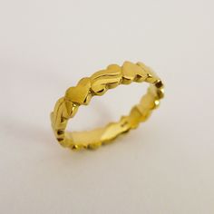 "14K / 18K Solid Gold Hearts Wedding Band Ring for Woman, Unique Delicate Ring made of Yellow, White, Rose Gold. This ring is engraved with four hearts connected with curved ornaments, inspired by \"Americana\" graphic style. It is a delicate ring with a unique, simple and sweet design. Made by hand out of wax, each shape is unique and create harmonious flowing. Dainty and stylish, it is a vivid and optimistic design to mark the endless love that connect our circle of life and create strong beau 14k Gold Heart Ring With Polished Finish For Wedding, 14k Gold Heart Ring For Wedding With Polished Finish, White Gold Heart Ring For Wedding, Gold Wedding Rings For Valentine's Day, Heirloom Gold Heart Ring For Wedding, Heirloom 22k Gold Wedding Rings, Yellow Gold Diamond Cut Heart Ring For Anniversary, Gold Heart Ring With Polished Finish For Wedding, Gold Heart Ring For Wedding Fine Jewelry