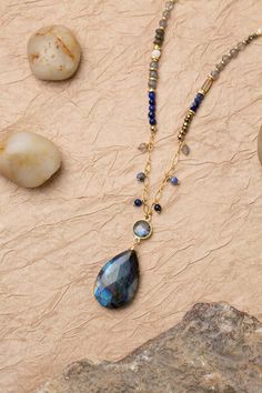 Discover the vibrant and stunning colors of the Blue Moon Collection in this eclectic necklace! Gold Filled (Lead & Nickel Free) Lapis Lazuli, Pyrite, Sodalite, Labradorite, Mother Of Pearl, Abalone 30.5-32.5" adjustable length, with gold filled lobster claw clasp We hand select our natural materials, thus there may be slight variations in color and/or size that will not detract from the overall aesthetic. Our unique handcrafted designer jewelry for women is made in America, each design created Eclectic Necklace, Floyd Va, The Blue Moon, Silver Gold Earrings, Silver Gold Necklace, Pyrite Necklace, Eclectic Jewelry, Moms Bracelet, Moon Collection