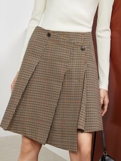 MO&Co. Women's Asymmetric Vintage Check Skirt Features : - Houndstooth plaid elements - Skirt with double buttonholes - Wide pressed pleated designCode: MBB3SKTT08The length of size M is 47.5cmBrown: Model is 176cm tall and wearing a size M MATERIALS & CARE : Material: 100% PolyesterDo not wash, do not bleach Hang to dry, tumble dry Iron at low temperature, professional dry cleaning Do not expose to the sunPlease select your own size in the size chart according to your figure and serve model siz Fall Workwear Pleated Skort, Fall Pleated Skort For Workwear, Fall Workwear Skort With Pleated Hem, Pleated Hem Skort For Workwear In Fall, Fall Pleated Mini Skirt For Office, Plaid Lined Skirt For Workwear, Plaid Skirted Skort For Fall, Fall Plaid Pleated Mini Skirt, Pleated Plaid Mini Skirt For Fall