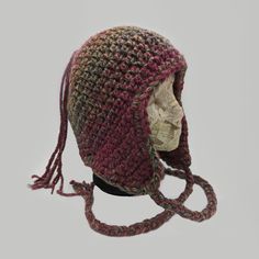 a crocheted hat on top of a mannequin head