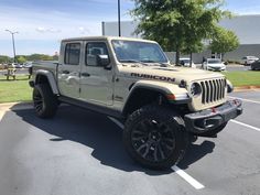 a white jeep parked in a parking lot