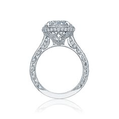 a diamond engagement ring with an intricate design on the side