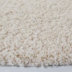 a close up view of a white rug