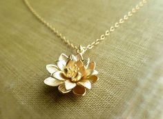 Gold Lotus Necklace ... symbolic flower pendant on a dainty gold filled chain on Etsy, $23.00 Dainty Brass Flower Pendant Jewelry, Gold Spiritual Flower Pendant Charm Necklaces, Gold Spiritual Charm Necklace With Flower Pendant, Delicate Handmade Gold Charm Necklaces, Dainty Gold Flower-shaped Jewelry, Gold Spiritual Flower Necklaces, Delicate Brass Jewelry With Flower Pendant, Gold Brass Necklace With Flower Charm, Gold Brass Flower Pendant Jewelry