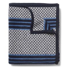 a blue and white blanket with black trim