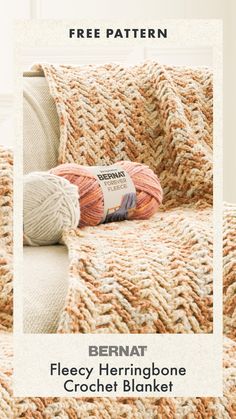 a crocheted blanket with two balls of yarn on it and the text bernat fleey herringbone crochet blanket