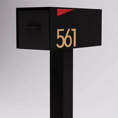 a black mailbox with the number 561 on it