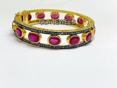 Listing is for (1) one beautiful Solid sterling silver 925 two tone pave diamond ruby bangle (price for one psc.) diamond wt: 2.1 cts. silver wt: 45 gms. stone wt: 8 cts. Gemstone name:- Diamond Ruby It's a beautiful bracelet (bangle). two tone pave diamond ruby bangle perfect for summers. Light weight . perfect for gifting and wedding. We keep on adding new products & designs every day so keep coming back to get more deals & designs. Bulk & wholesale orders are welcome on this desig Gold Ruby Jewelry With Pave Setting, Round Bangle With Rose Cut Diamonds, Silver Ruby Jewelry With Pave Setting, Round Diamond Bangle With Rose Cut Diamonds, Pave Setting Bangle As Gift, Fine Jewelry Bangle With Pave Setting As Gift, Oval Hand Set Bangle For Anniversary, Diamond Bangle With Rose Cut Diamonds As Gift, Oval Diamond Bangle For Gift