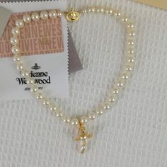 Brand New Vivienne Westwood Pearl Necklace In Gold Brand New, Never Worn, Nwot 100% Authentic The Approx : L 19'' Comes With Gift Box, Gift Bag, And Dust Bag,Brand Cards,Instruction Manual,Jewelt Cloth. Full Packing As Inculded. Necklace Packed In Secure Packaging For Transit Welcome To Share And Offer. Thanks So Much." Westwood Pearl Necklace, Vivienne Westwood Pearl Necklace, Vivienne Westwood Jewelry, Vivienne Westwood Jewellery, Saturn Necklace, Square Necklace, Pearl Pin, Rainbow Necklace, Round Necklace