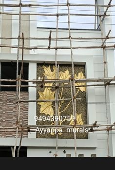 a building with scaffolding around it and a sign on the wall that says avaappamamals