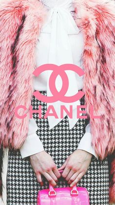 a woman holding a pink purse in front of her face with the words chanel on it