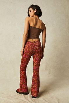 Classic Free People pull-on flares are in a bold boho print featured in a mid-rise with an elastic waistband.* Clean silhouette with a flat front & perfectly placed back pockets* Flare leg* Stretch fabric* Back knee seam detailing Boho Trousers, Free People Flare Jeans, Bold Boho, Orange Fits, Jeans Free People, All Jeans, Leg Stretching, Closet Space, Boho Print