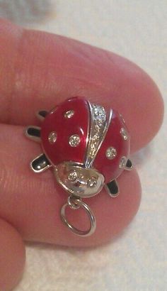 AUTHENTIC TIFFANY & CO. PLATINUM RED ENAMEL DIAMOND LADYBUG PENDANT NECKLACE  MATERIAL: Platinum THE PENANT WEIGHS: 7.5 grams (not including the cord) THE ENAMEL LADYBUG: Height/Length: 0.65", Width: 0.65" DIAMONDS: 18 round brilliant diamonds about .48TCW HALLMARKED: T & Co. PT950  CONDITION: Looks new recently serviced by store  I will include the new 18" black silk cord, the blue box. Ladybug Necklace, Silk Cord, Blue Box, Fine Jewellery Necklace, Black Silk, Tiffany & Co., Round Brilliant, Charm Pendant, Jewelry Necklace Pendant