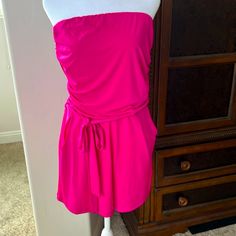 Beautiful Pink Color. Strapless With Tie Belt And Pockets. Stretchy Waistband And Stretchy Top. Summer Strapless Stretch Jumpsuit, Summer Stretch Strapless Jumpsuit, Stretch Strapless Tube Top For Loungewear, Summer Strapless Bandeau Jumpsuit, Strapless Bandeau Jumpsuit For Summer, Bandeau Jumpsuits And Rompers For Spring Night Out, Strapless Jumpsuits And Rompers For Summer Loungewear, Stretch Strapless Jumpsuit For Beach, Chic Strapless Jumpsuit For Loungewear