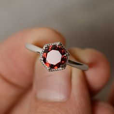 This is a gorgeous handmade creation. Its beauty is its simplicity & Elegance. The 7mm round cut natural garnet is crafted in solid sterling silver and with rhodium plated. All item is sent in a beautiful gift box You can realize more lovely stuff clicking the link https://www.etsy.com/shop/knightjewelry?refshopsection_shophome_leftnav Please leave the correct address and you phone number for delivering successfully. Fine Jewelry Garnet Solitaire Ring, Garnet Ruby Ring For Promise, Garnet Solitaire Rings, Round Garnet Jewelry For Promise, Round Garnet Solitaire Ring, Round Garnet Promise Jewelry, Red Sterling Silver Rings With Round Cut, Ruby Ring With Halo Setting For Promise, Wedding Silver Garnet Birthstone Ring