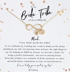 the bride tribe necklace has two initials on it and is attached to a gold chain