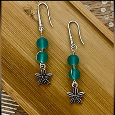 New Frosted Aqua Blue Bead Starfish Earrings With 925 Silver Ear Wire Hooks. Earrings Are 2 1/4 Inches Long. Handmade Turquoise Starfish Jewelry, Handmade Green Starfish Jewelry, Bohemian Silver Jewelry With Starfish Charm, Handmade Green Starfish-shaped Jewelry, Silver Wire Wrapped Ocean-inspired Jewelry, Silver Wire Wrapped Ocean-themed Jewelry, Silver Ocean-inspired Wire Wrapped Jewelry, Blue Star-shaped Sterling Silver Earrings, Blue Sterling Silver Star Earrings