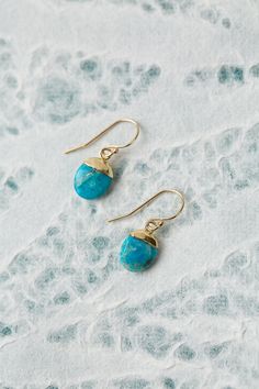 The Surrender Collection is soft and captivating. These simple turquoise earrings are finished with gold filled ear wires and are ideal for pairing with other items from the collection. Gold Filled (nickel and lead-safe) Turquoise 1", with gold filled ear wires We hand select our natural materials, thus there may be slight variations in color and/or size that will not detract from the overall aesthetic Our unique handcrafted designer jewelry for women is made in America, each design created indi Turquoise Dangle Jewelry With French Hook, Everyday Turquoise Brass Jewelry, Turquoise Brass Jewelry With Ear Wire, Turquoise Jewelry With French Hook For Gift, Blue Drop Earrings In 14k Gold Filled, Turquoise 14k Gold Filled Earrings For Gift, Turquoise 14k Gold Filled Earrings As Gift, Gift Turquoise 14k Gold Filled Earrings, Blue 14k Gold-filled Drop Earrings